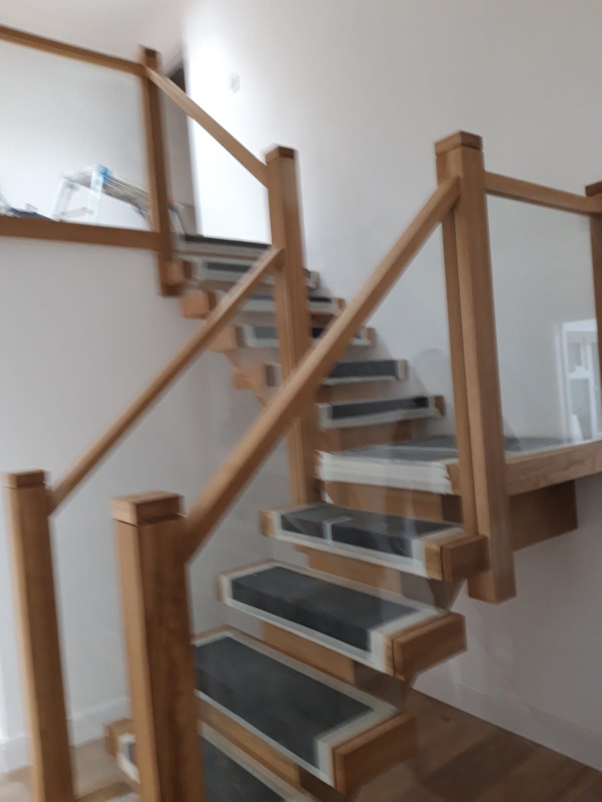 Oak and glass staircase with a quarter landing