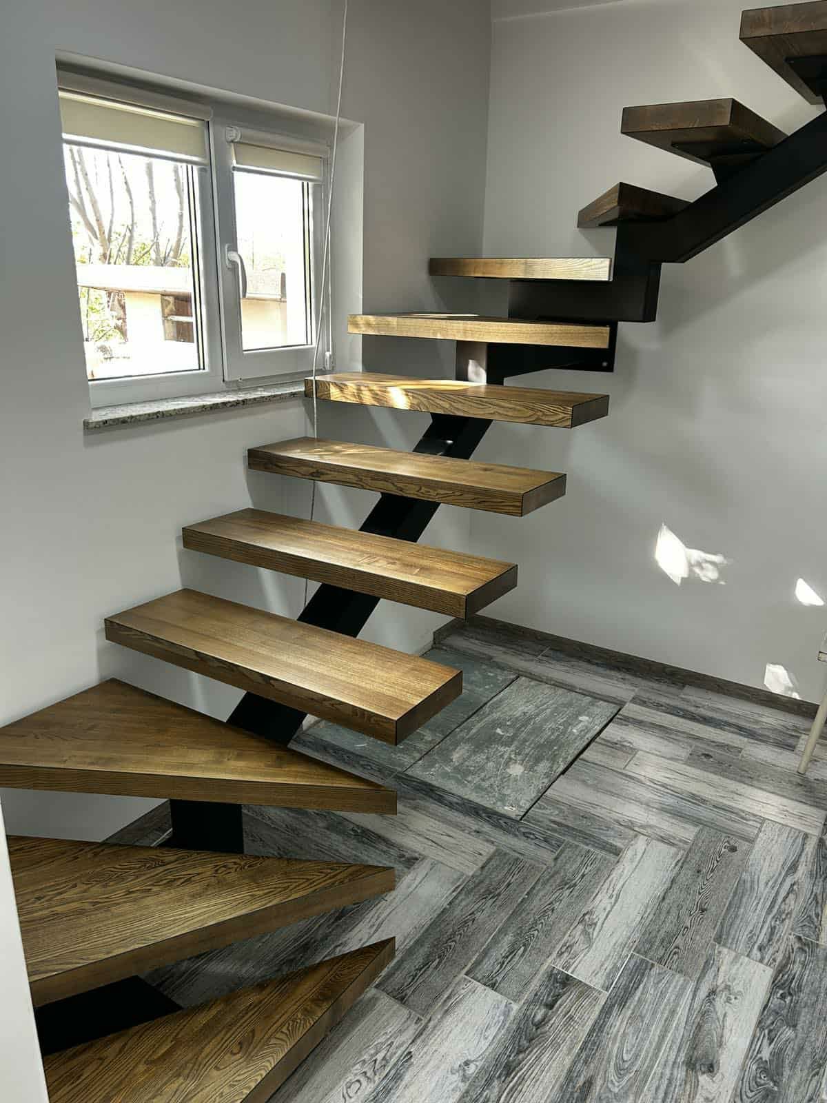 Floating oak treads on a steel spine