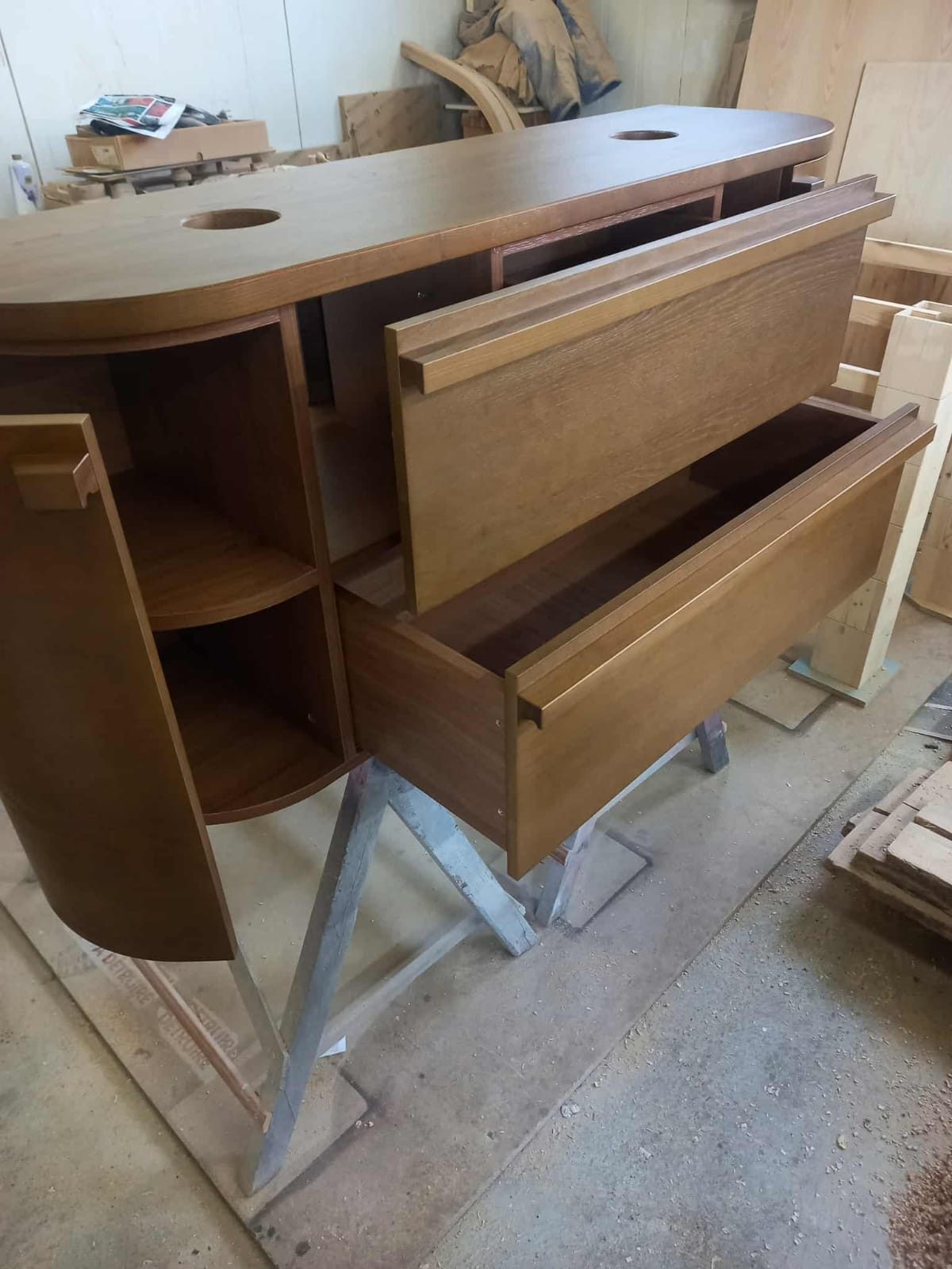 Curved oak unit with drawers in the workshop