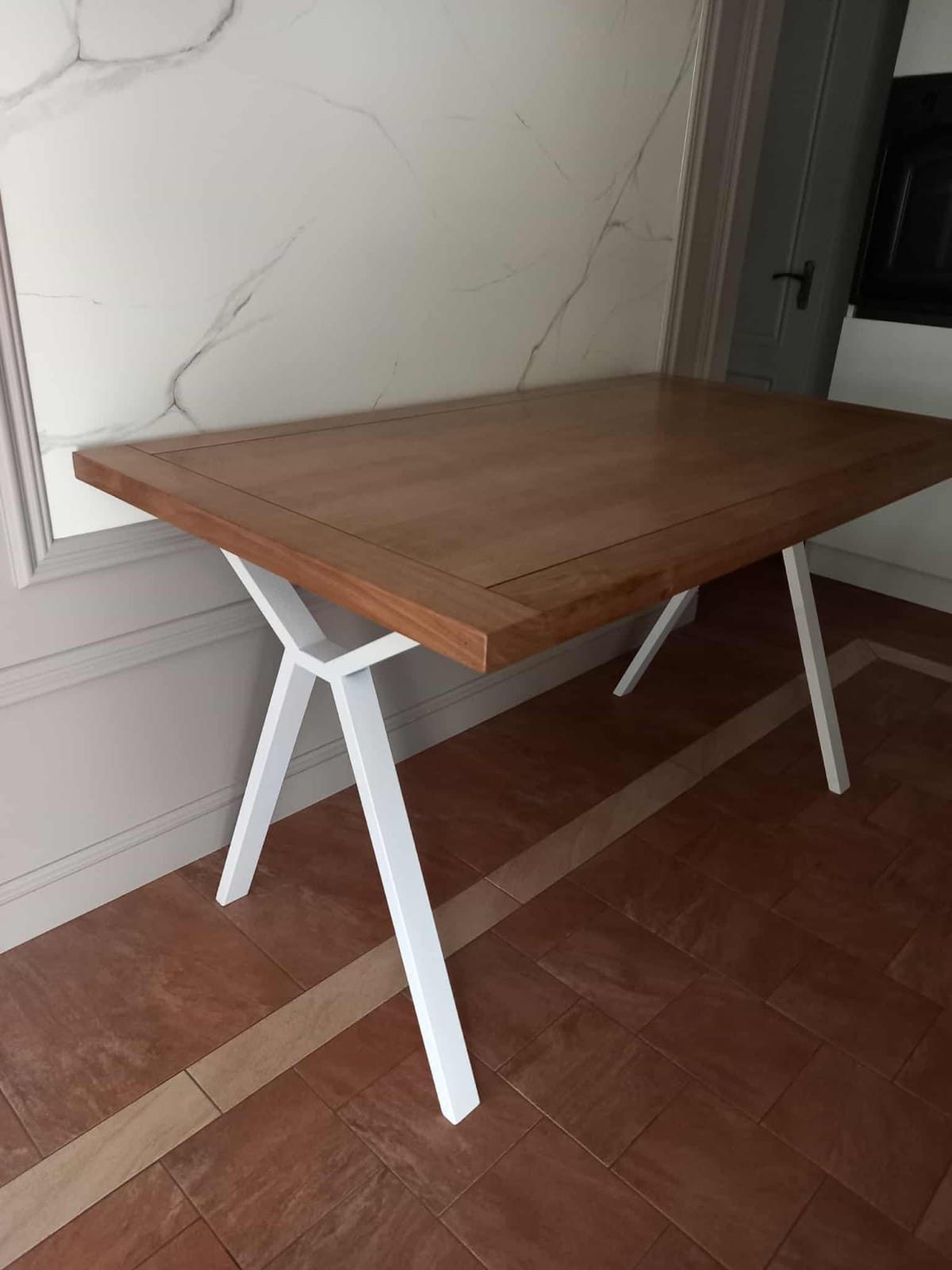 Oak dining table on white steel legs