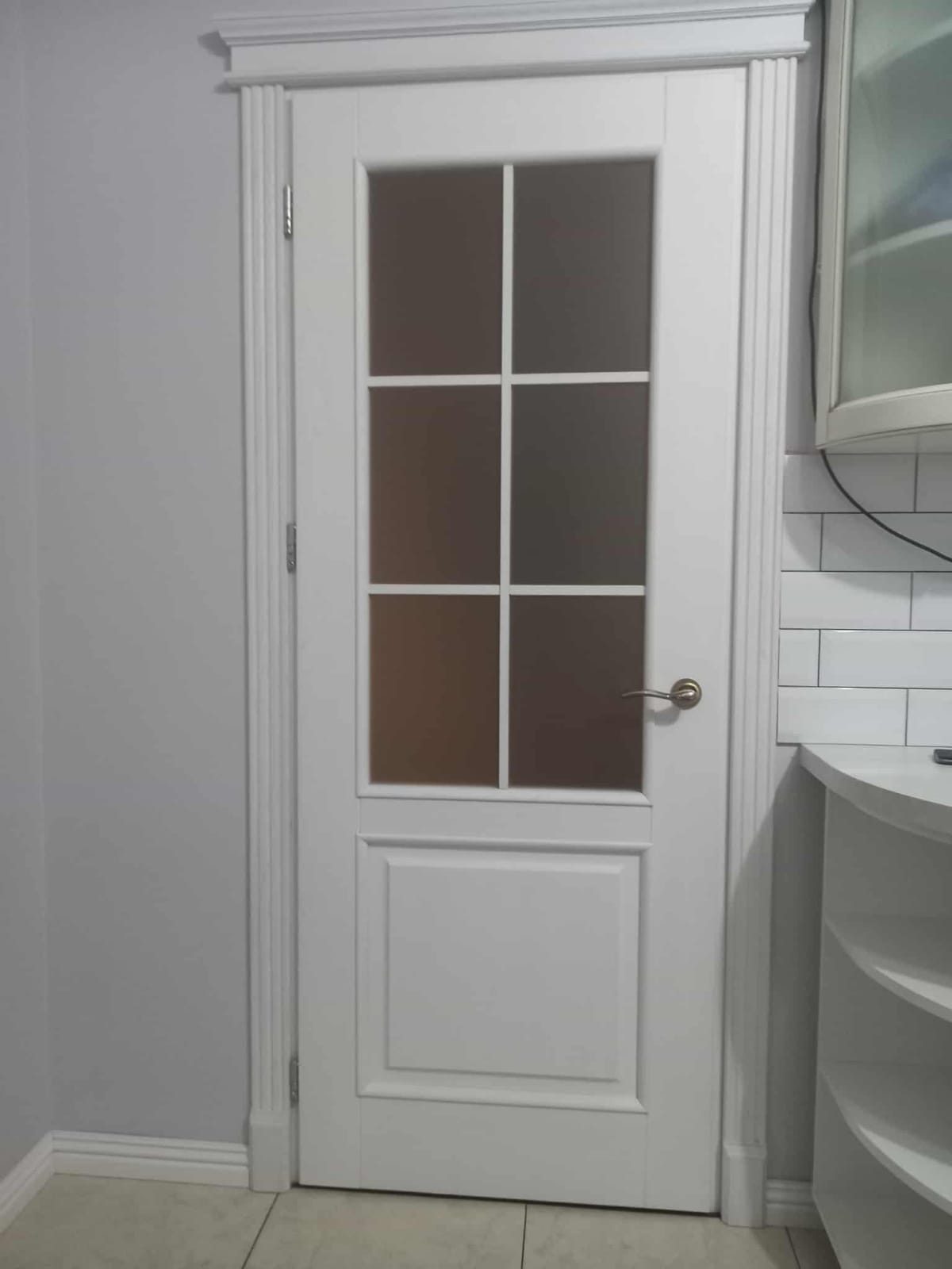 Painted glazed door with architrave