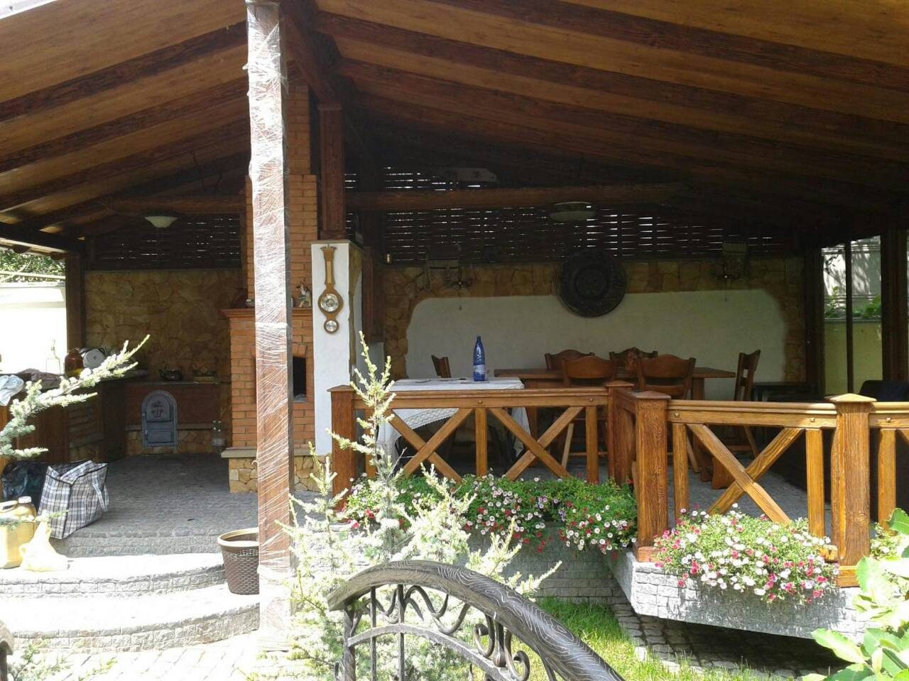 Timber gazebo with cross-braced railings