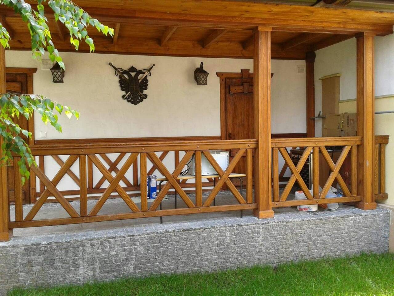 Covered veranda with cross-braced railings